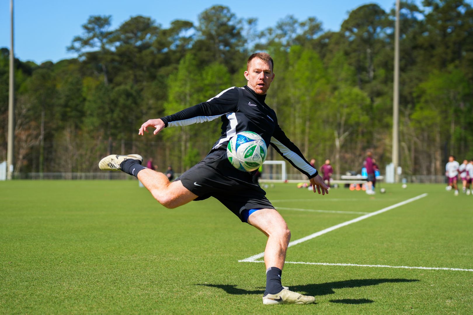 Assistant coach Renfro striking a ball in training